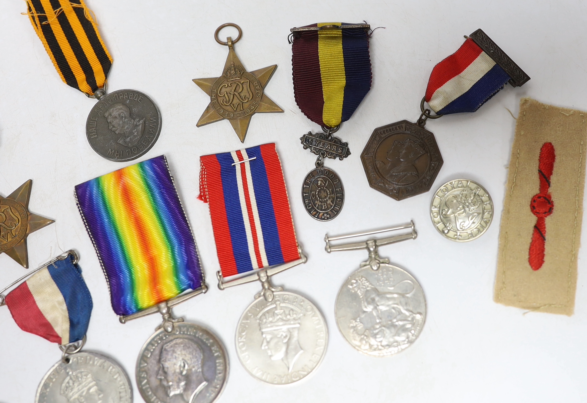 Twelve medals including; a British War Medal, a Victory Medal, three 1939-45 War Medals, two 1939-45 Stars, an Edward VIII Coronation Medal, a Soviet Stalin Victory medal, a Pakistan General Service Medal, a George VI Co